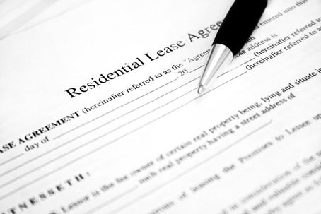 residential lease agreement paperwork with pen