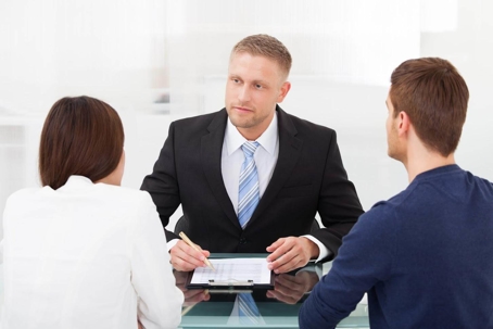 woman and man at a table with an attorney